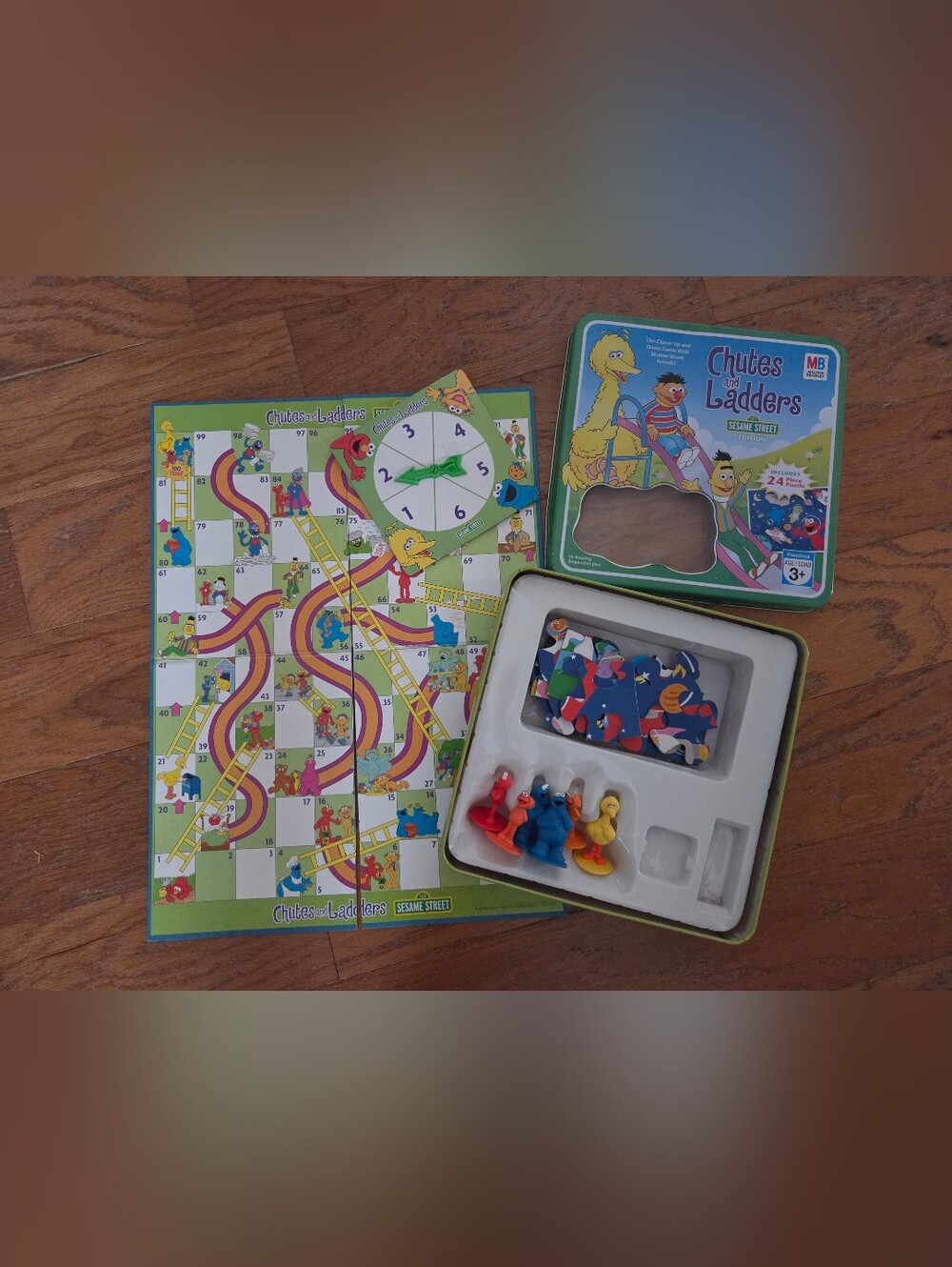 Sesame Street Chutes & Ladders Board Game with Puzzle Of 24 Pieces